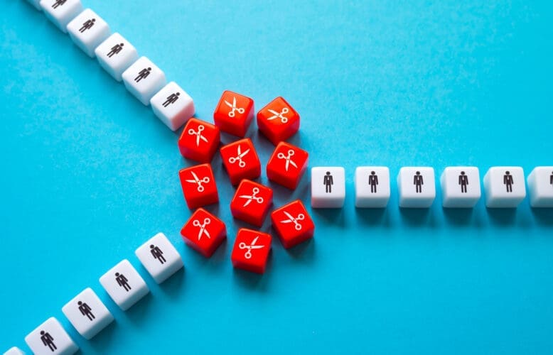 The division of the staff into two divisions of the company. Mass layoffs, work optimization and cost reduction. Crisis and downsizing of business. Reduce and save business. Keep the best employees.