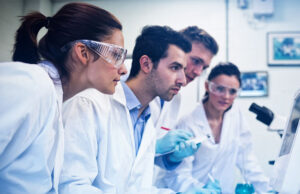 Serious researchers looking at computer screen in the lab