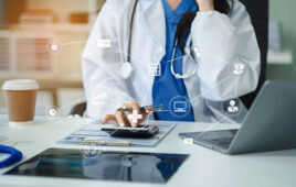 Healthcare costs and fees concept.Hand of smart doctor used a calculator for medical costs in modern hospital with VR icon diagram.