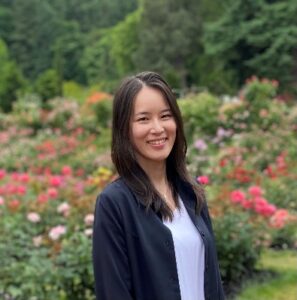 Author headshot taken at botanical gardens