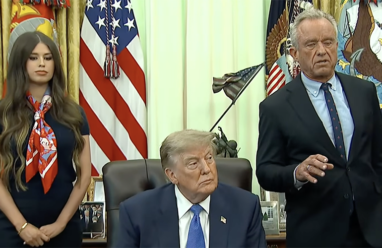 President Donald Trump, center, with Jayme Franklin, founder and CEO of The Conservateur, and HHS Secretary Robert F. Kennedy Jr. during the Aug. 10 announcement of an executive order on childhood vaccine recommendations.