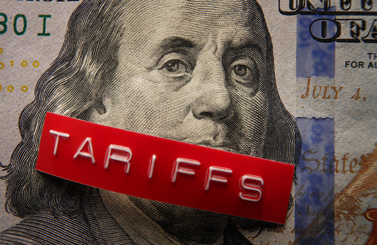 Red Tariffs label on a hundred dollar bill
